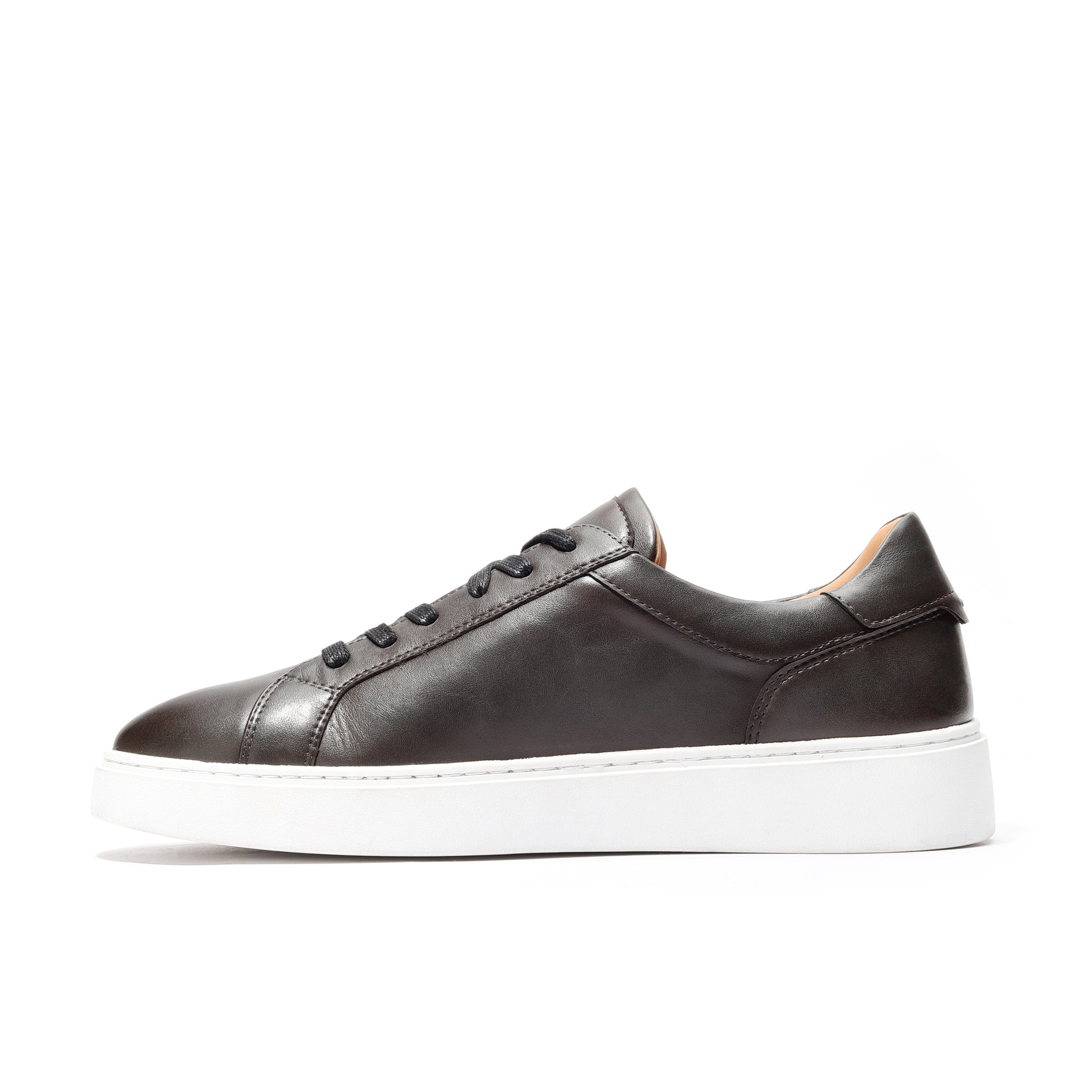 Lifestyle shot of black leather sneakers men designed for modern, casual wear.
