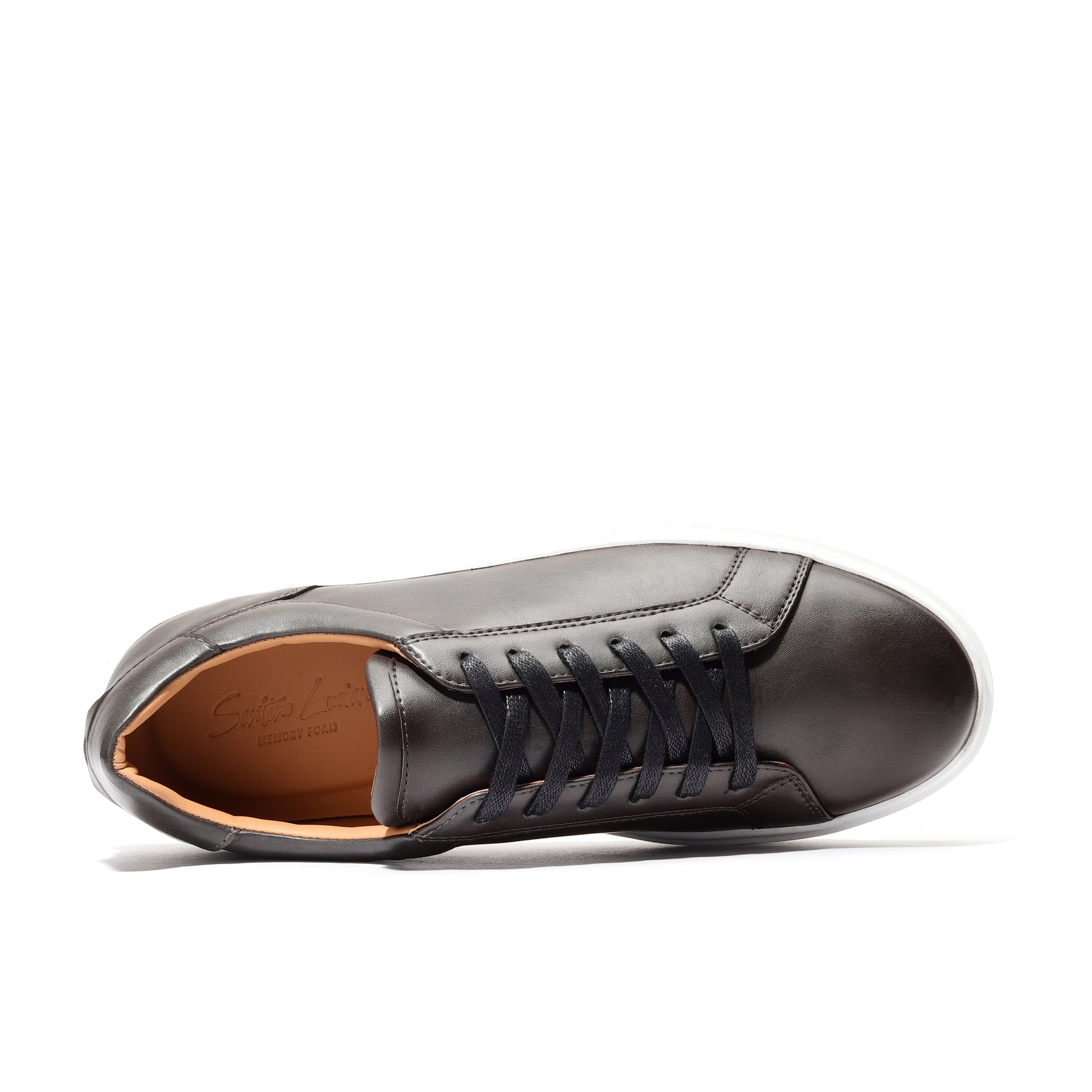Angled view of brown full-grain leather sneakers with classic low-top silhouette.