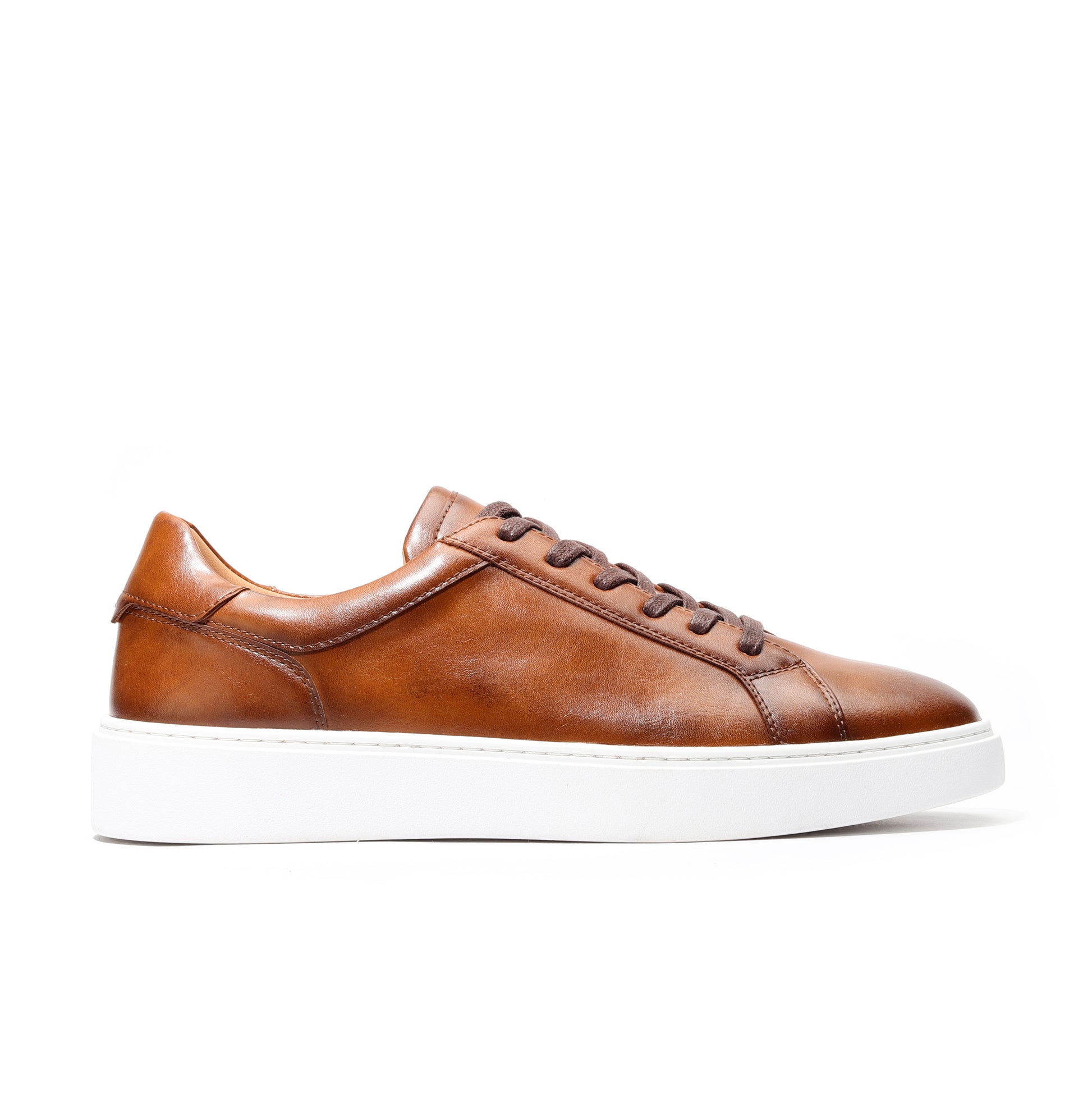 Close-up of brown luxury leather sneakers for men highlighting soft leather texture.