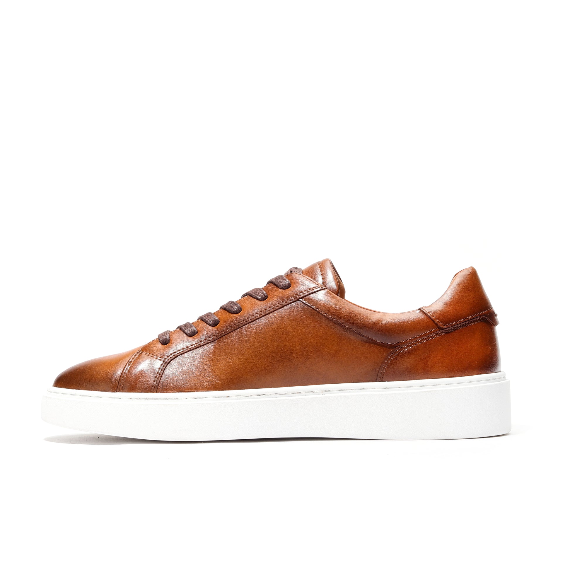 Lifestyle shot of brown leather low-top sneakers blending comfort and style.