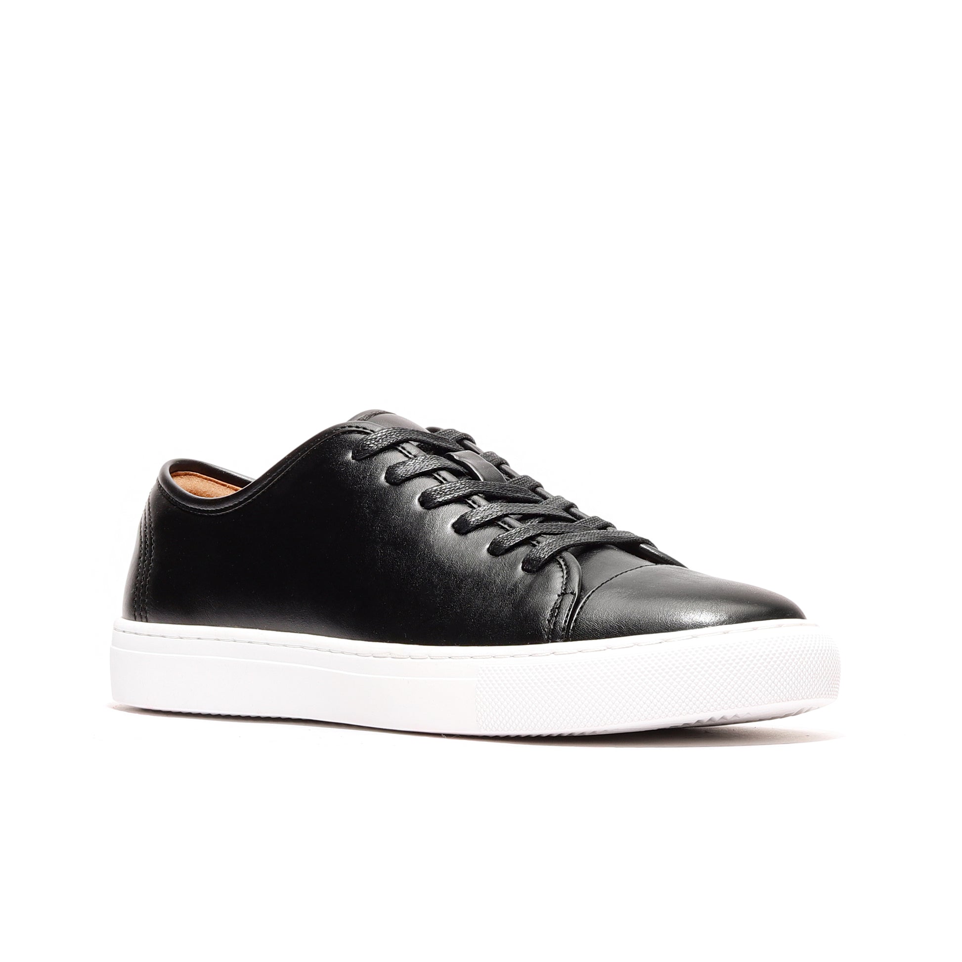 Side profile of black premium leather sneakers men, crafted with cap-toe detail and stitched rubber outsole.