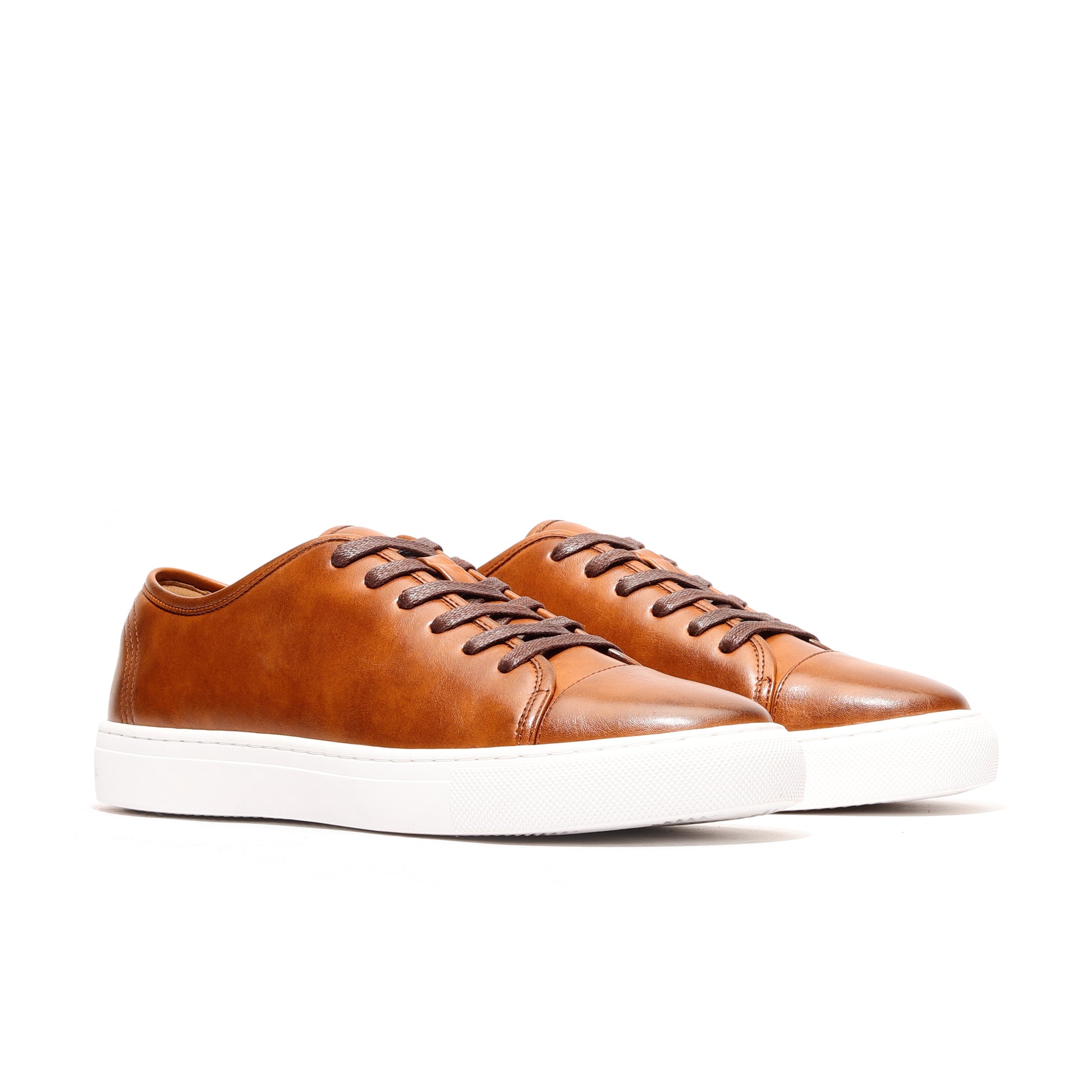 Angled view of cognac Oscar Cap-Toe Sneaker by Passi Sovrani, premium leather sneakers men with classic low-top design.