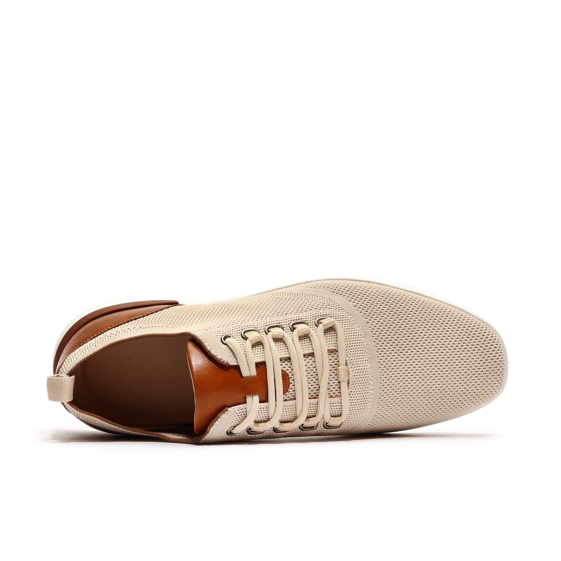 Top view of beige men’s athleisure shoes showcasing a sleek design and comfortable fit.