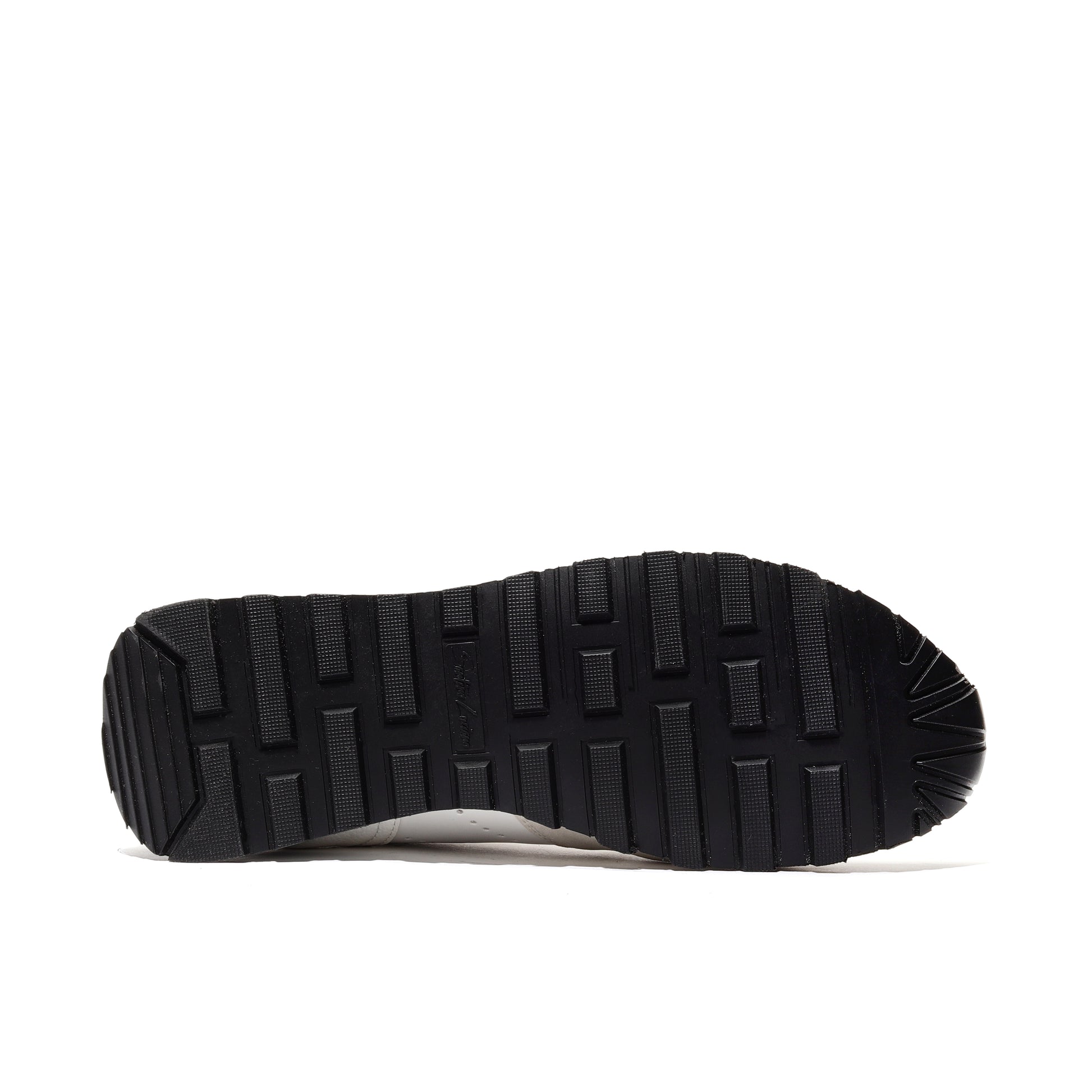 Close-up of the outsole of black athleisure performance sport runner shoes, featuring a durable traction pattern designed for superior grip and stability during running and everyday activities.