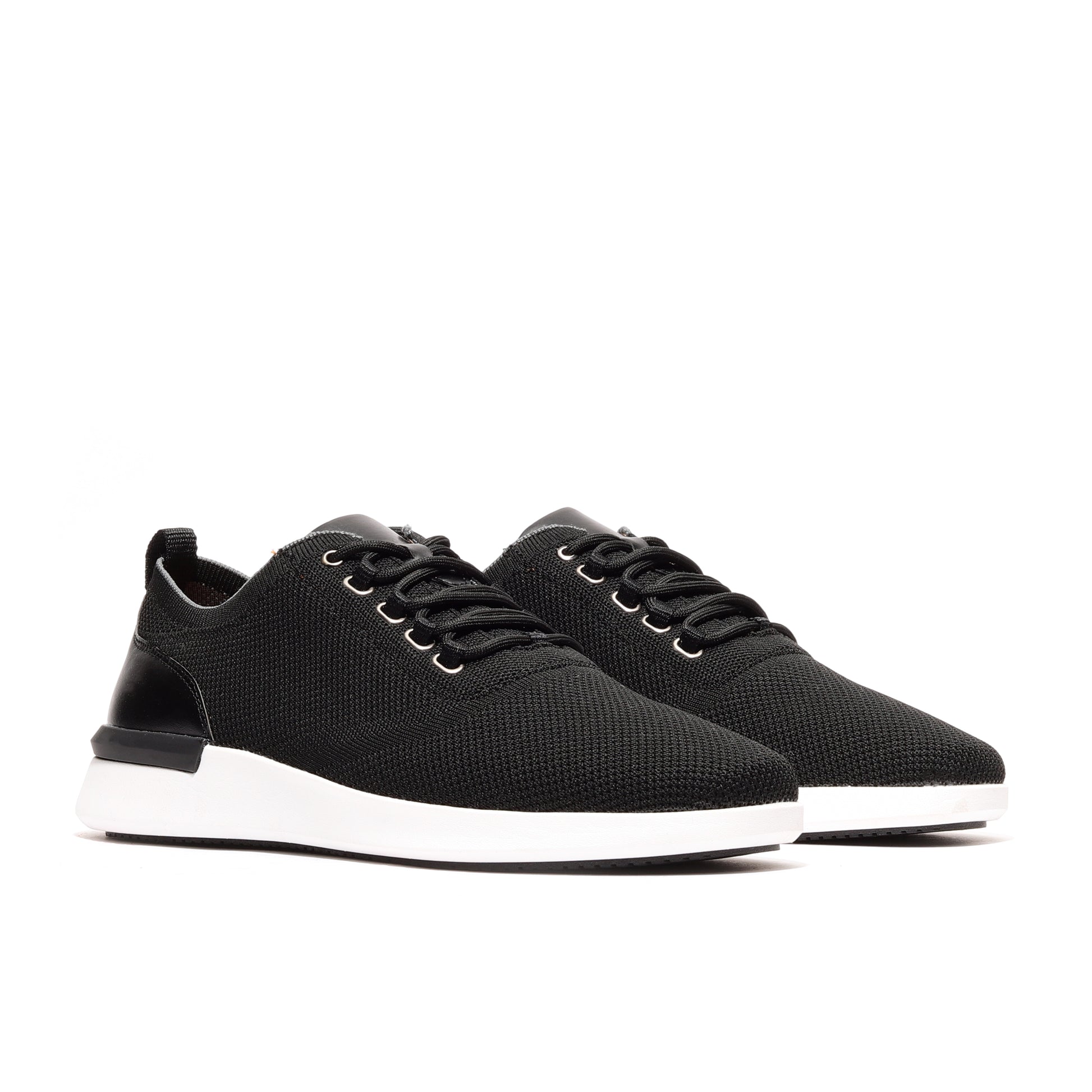 Angled profile of two black men's athleisure sneakers, highlighting sleek design, comfort, and versatility for modern, everyday wear.