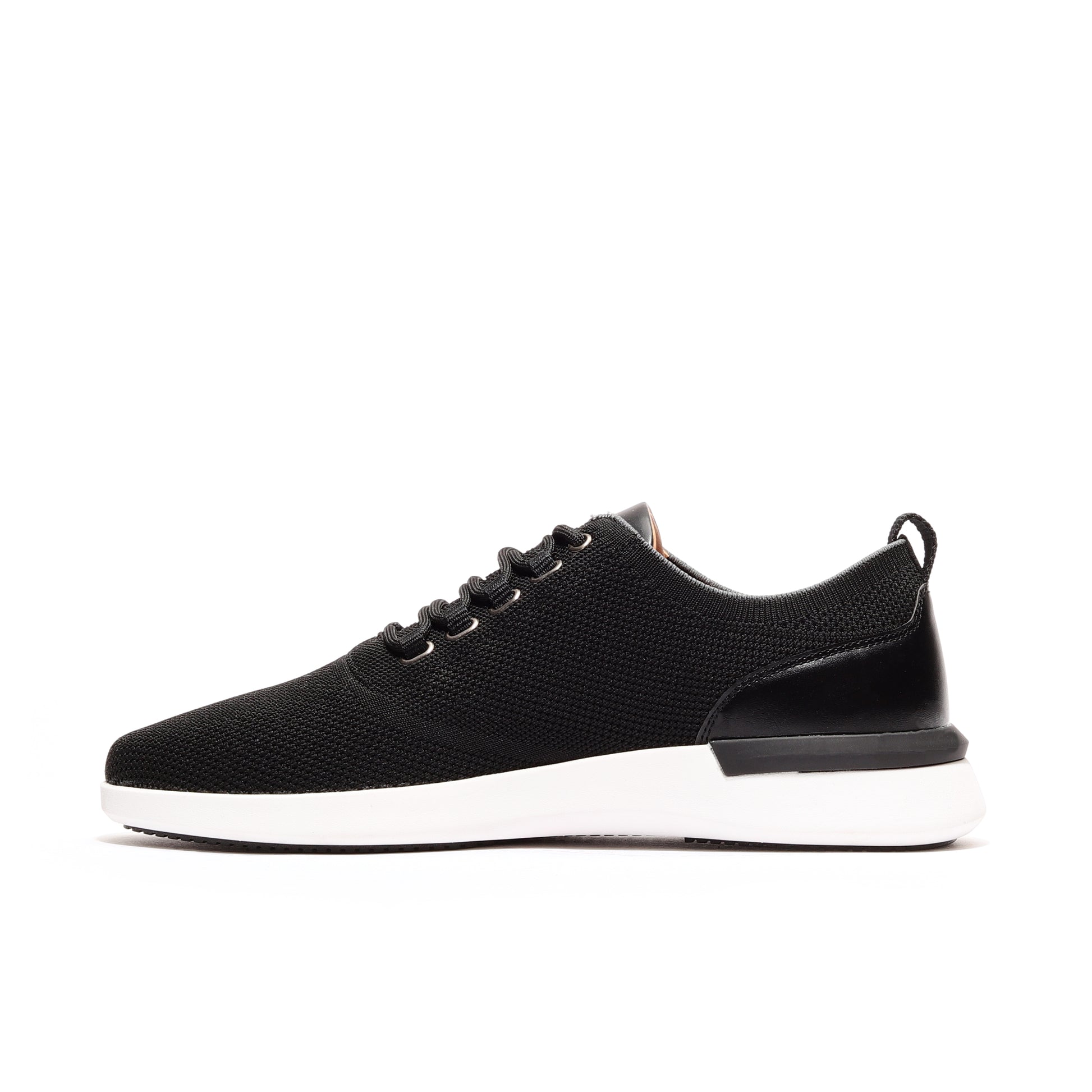 Side profile of black men's athleisure sneakers, offering a sleek, modern design with all-day comfort and versatile style.