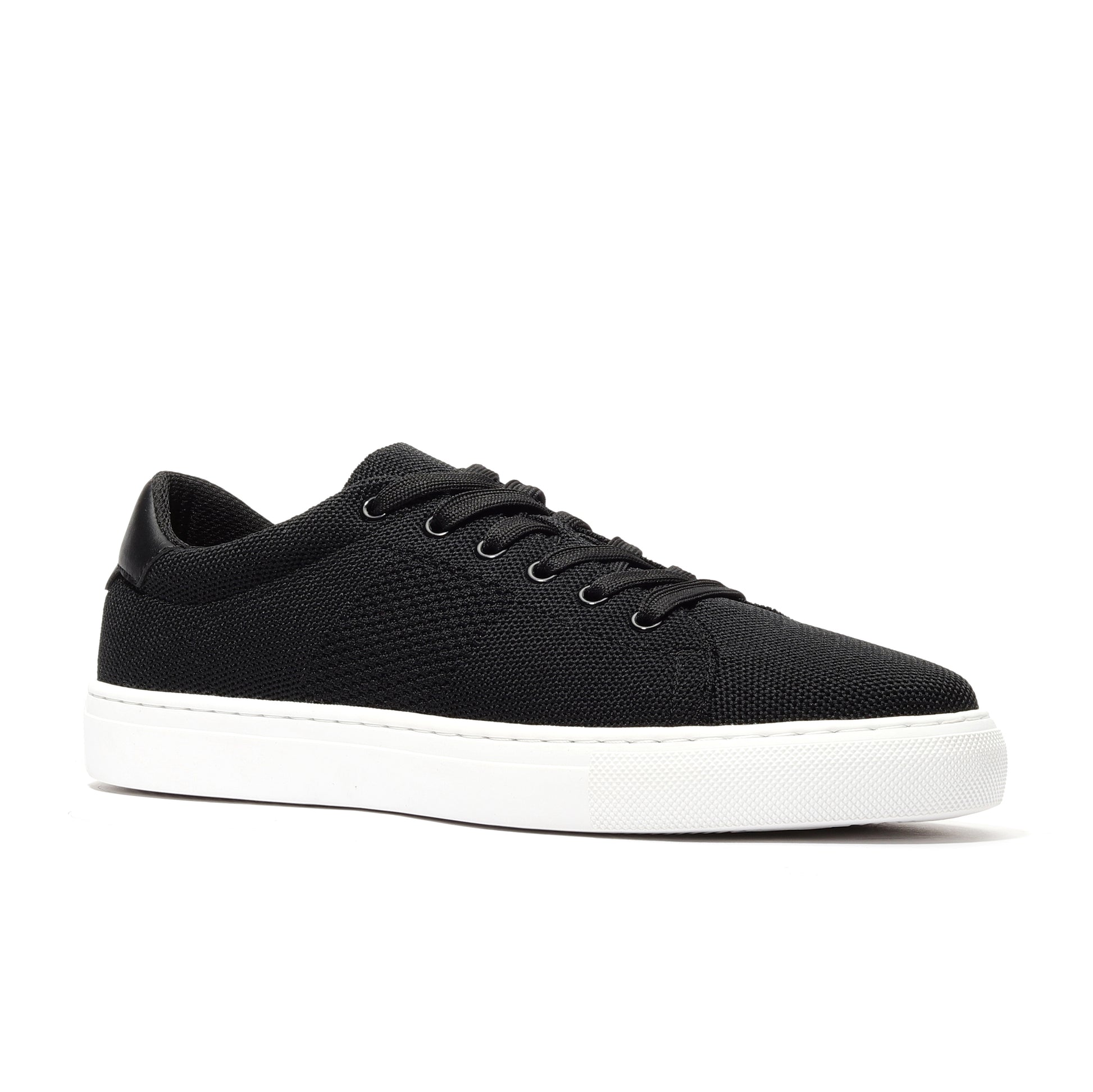 Black sport knit sneaker angled view showcasing the breathable mesh upper, flexible sole, and modern, sleek design. Perfect for workouts, running, or casual wear, offering a combination of comfort, durability, and style for active lifestyles.