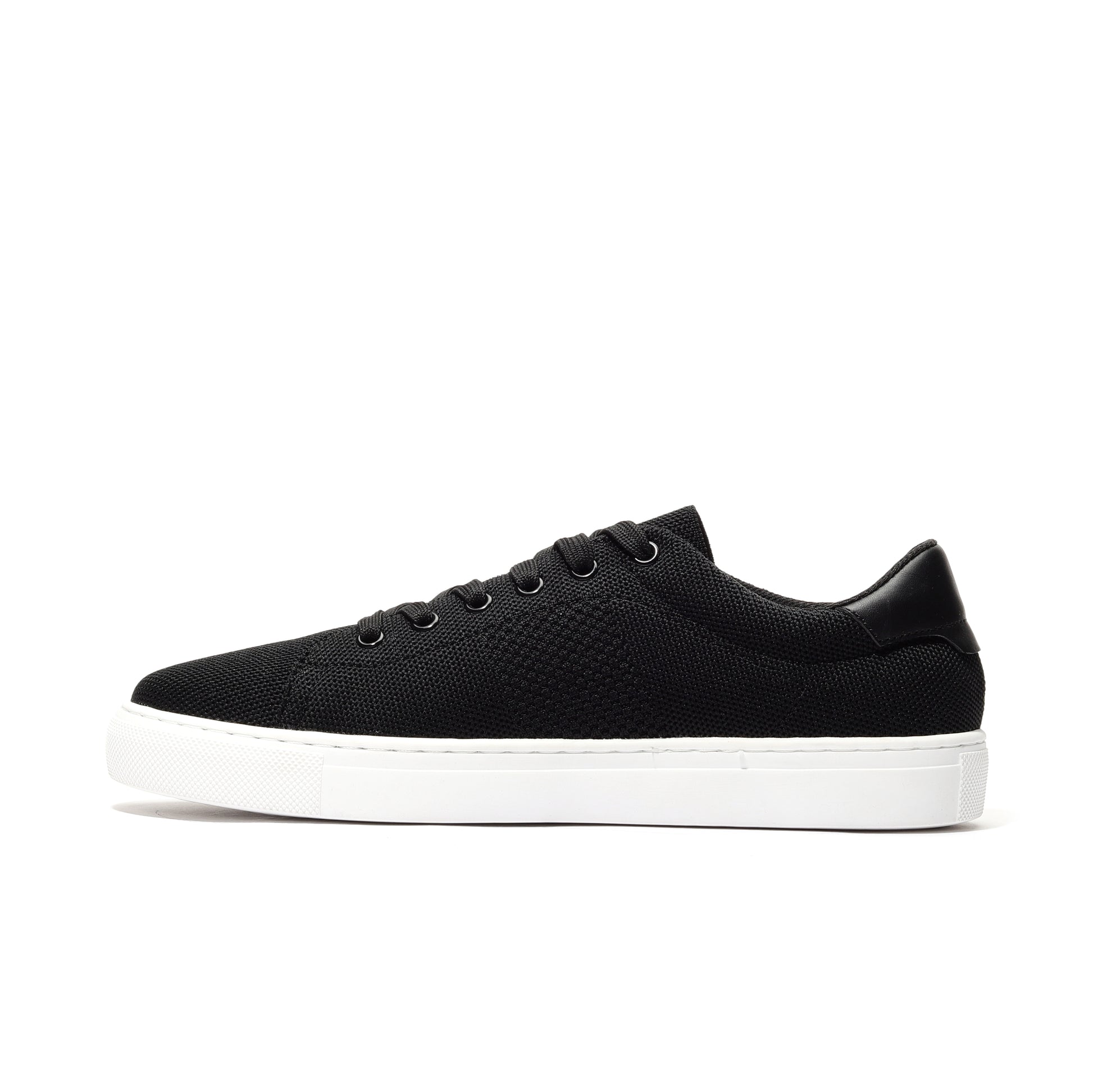 Black sport knit sneaker side view featuring a breathable mesh upper, cushioned sole, and flexible design for ultimate comfort. Ideal for running, gym sessions, or casual wear, offering a stylish, lightweight shoe for active lifestyles.