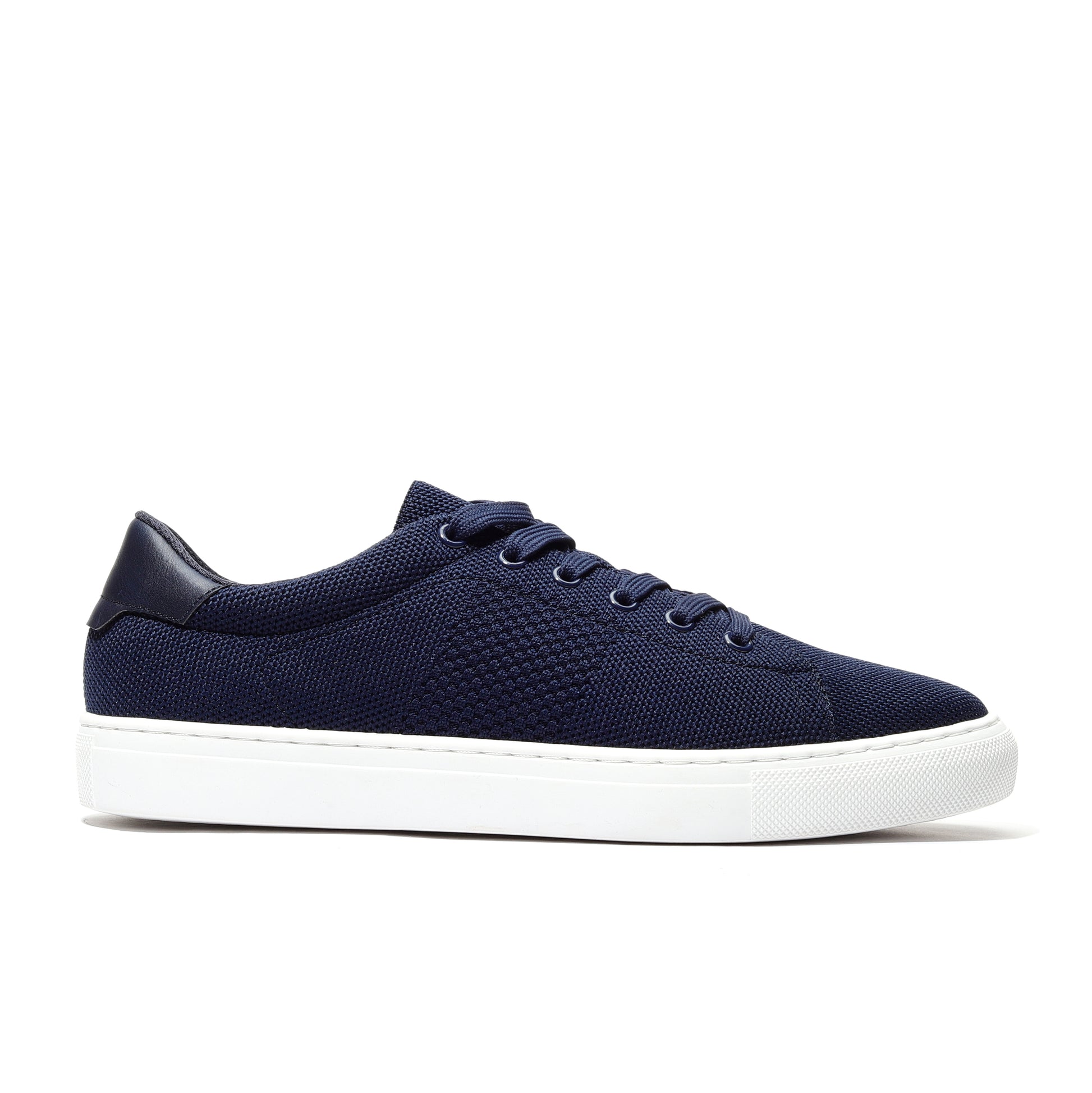 Navy sport knit sneaker side view featuring a breathable mesh upper, cushioned sole, and a streamlined design for a perfect fit. Ideal for casual wear, running, or workouts, offering comfort, support, and a stylish athletic look.
