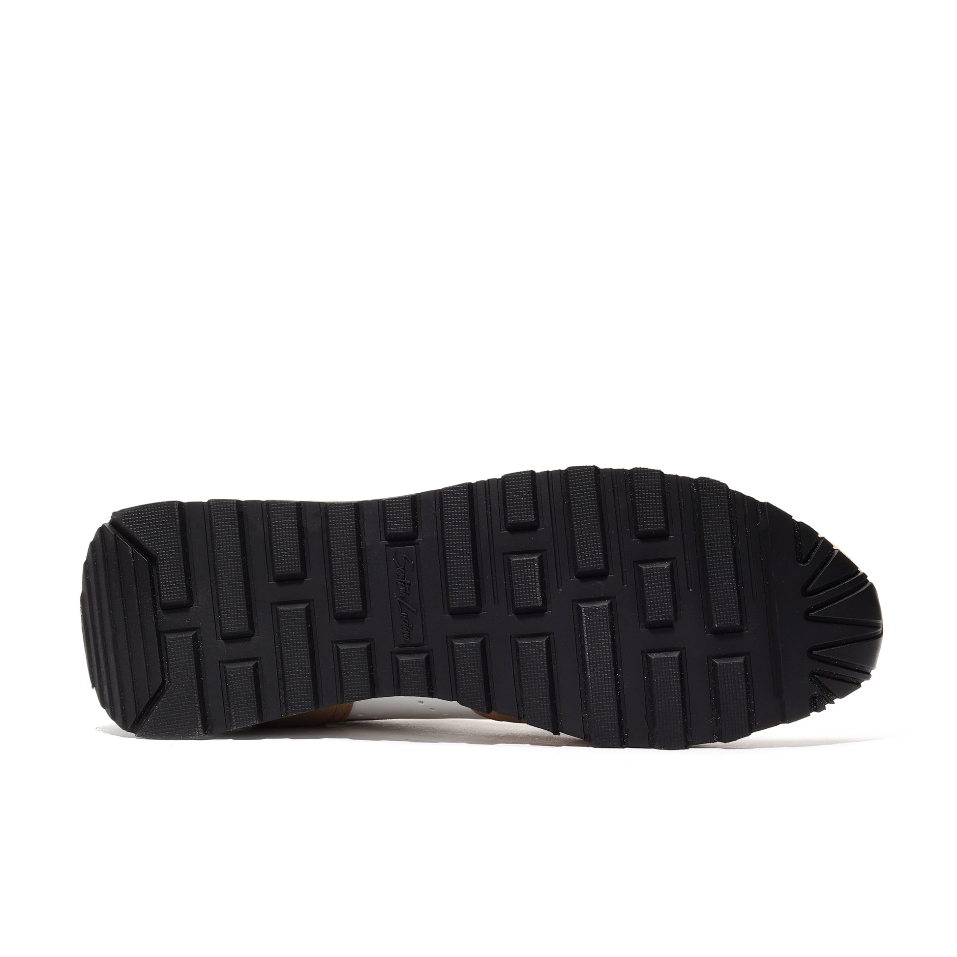 Close-up of the outsole of sand-colored athleisure performance sport runner shoes, featuring a durable traction pattern designed for superior grip and stability during running and everyday activities.