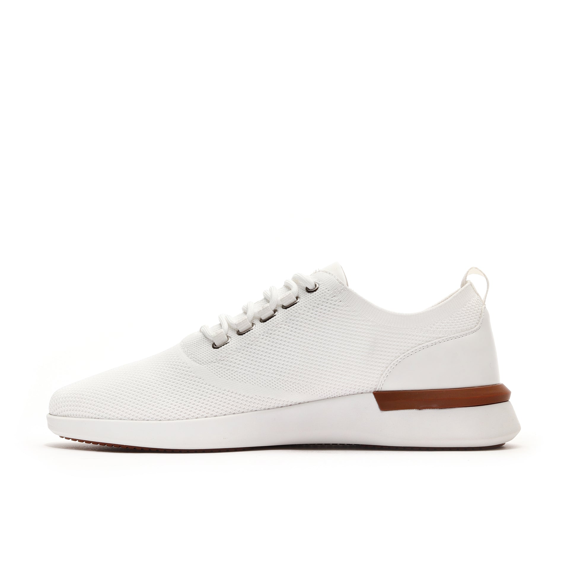 Side profile of white men's athleisure sneakers, designed for a modern look with everyday comfort and versatility.