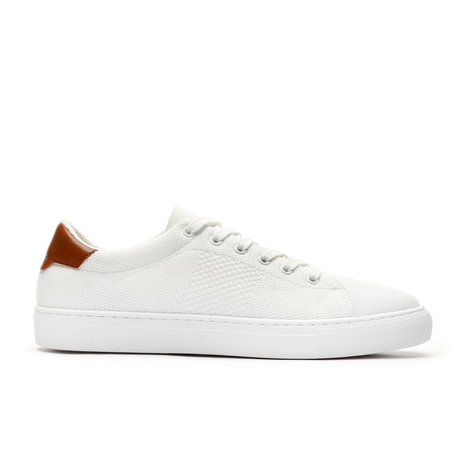 White sport knit sneaker side view featuring a breathable mesh upper, lightweight design, and cushioned sole for superior comfort. Ideal for casual wear, running, or workouts, offering a stylish and versatile addition to any active wardrobe.