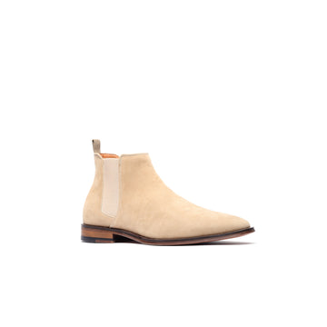 Angled view of sand suede Chelsea boots for men – premium suede with elastic side panel.